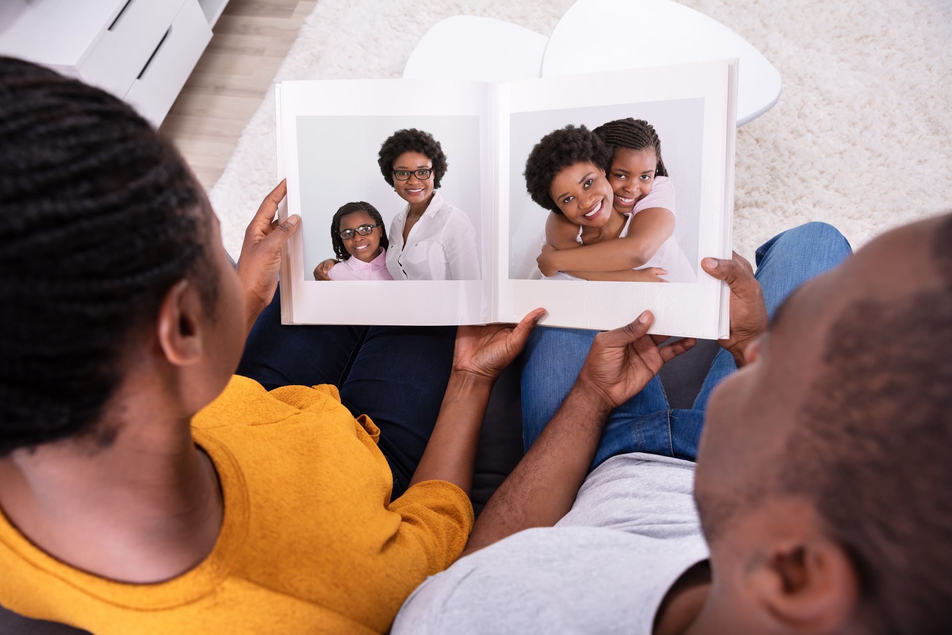 A black and white photo of a family with two children.