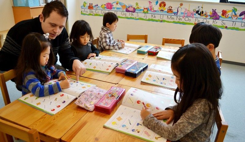 Japanese children studying English with a Canadian teacher