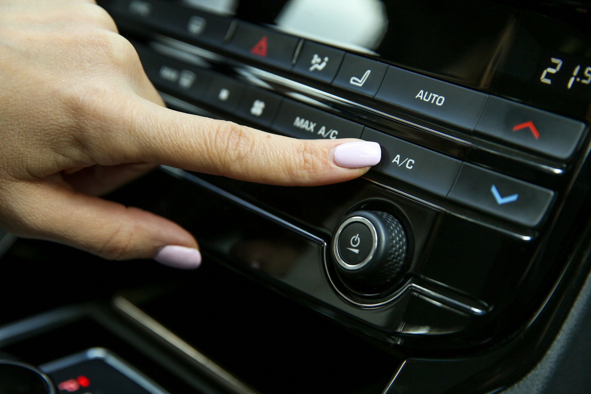 Pushing A/C Button — Frisco, TX — Solutions Automotive