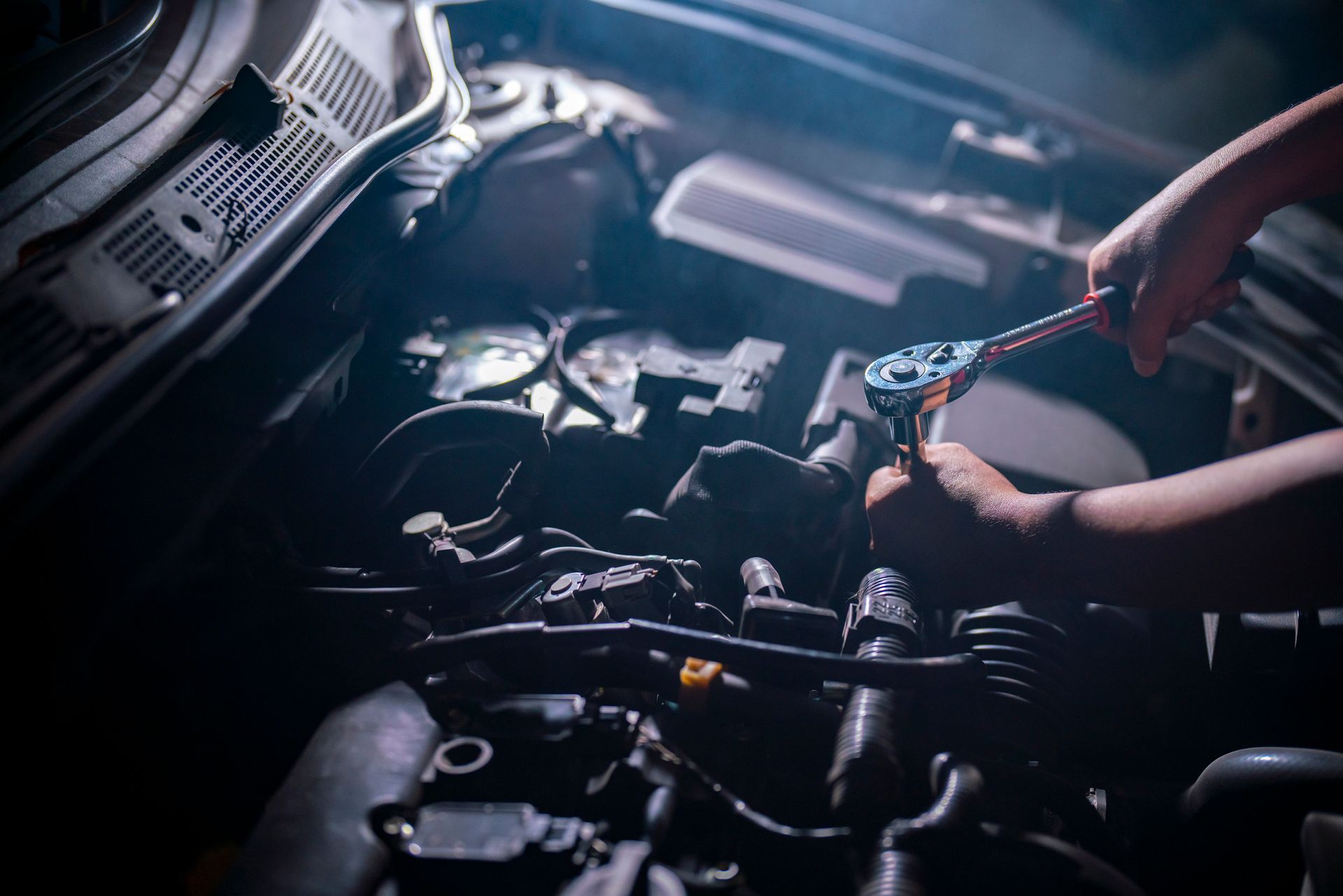 Man Repairing Car Engine — Frisco, TX — Solutions Automotive
