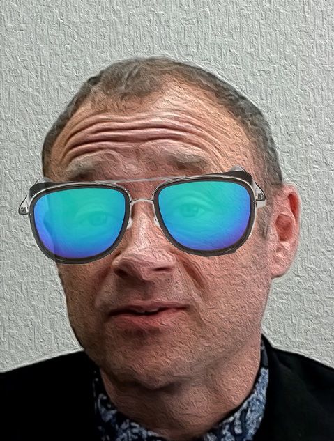 A man wearing sunglasses is making a funny face