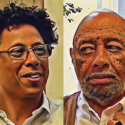 A man with glasses and a beard is next to another man with a beard.