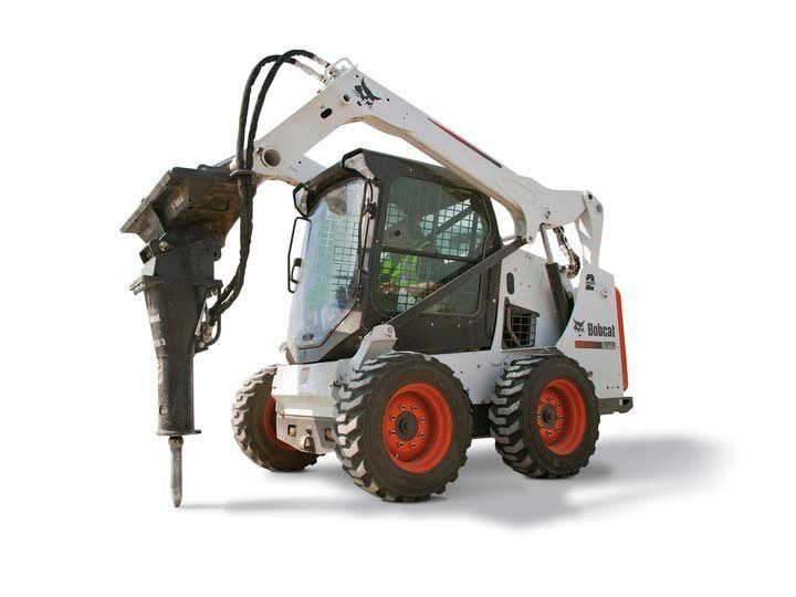 White Bobcat skid-steer loader with a hydraulic breaker attachment, breaking up pavement, on a white background.