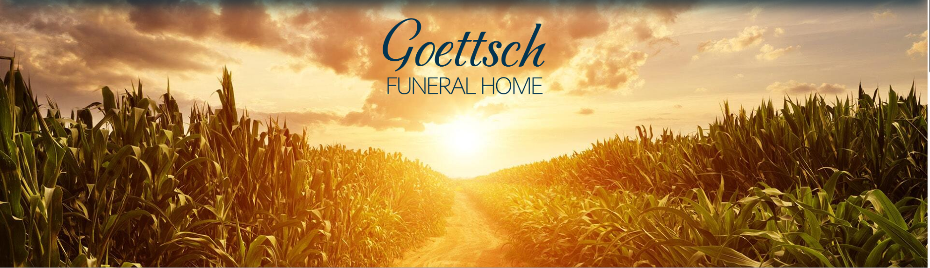 A sunset shines over a dirt path through a cornfield, with the text 
