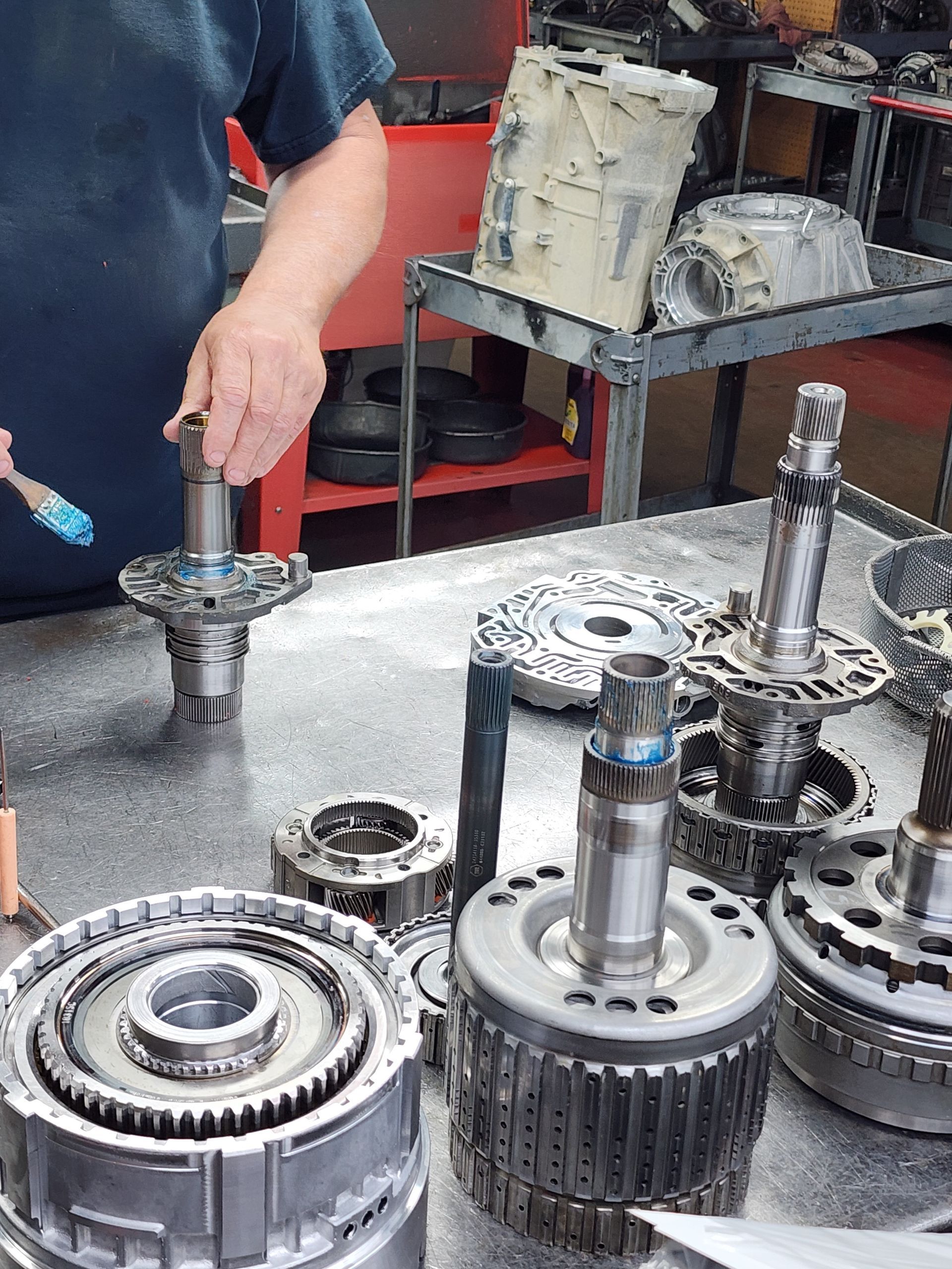 Cutaway view of shiny metal gears and mechanical components in a machine.