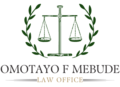 A logo for Omotayo F Mebude Law Office with a scale of justice and a laurel wreath.