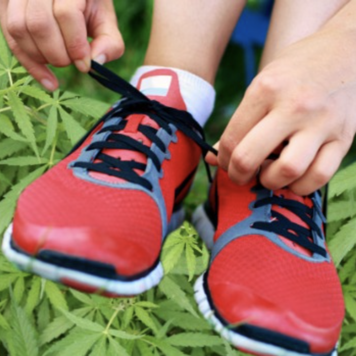 Picture of a person putting on running shoes.