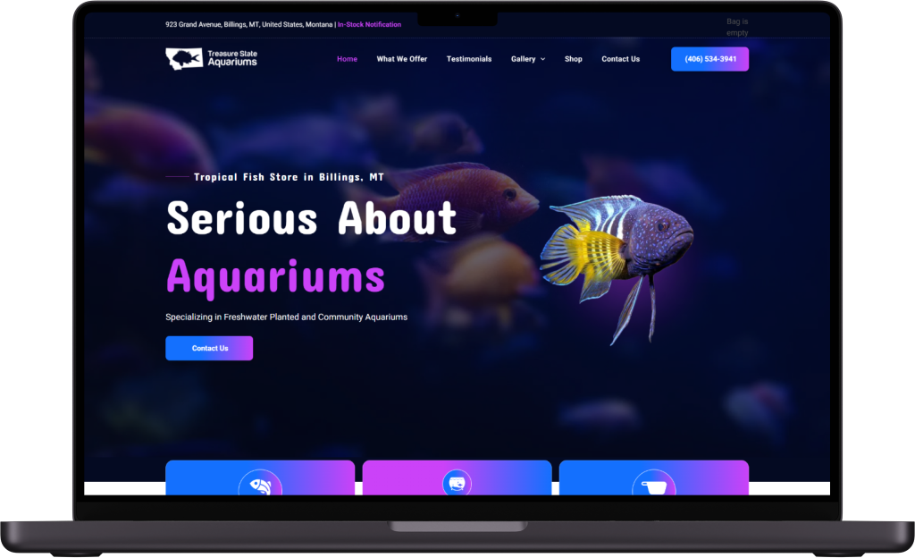 A laptop computer is open to a website about aquariums.