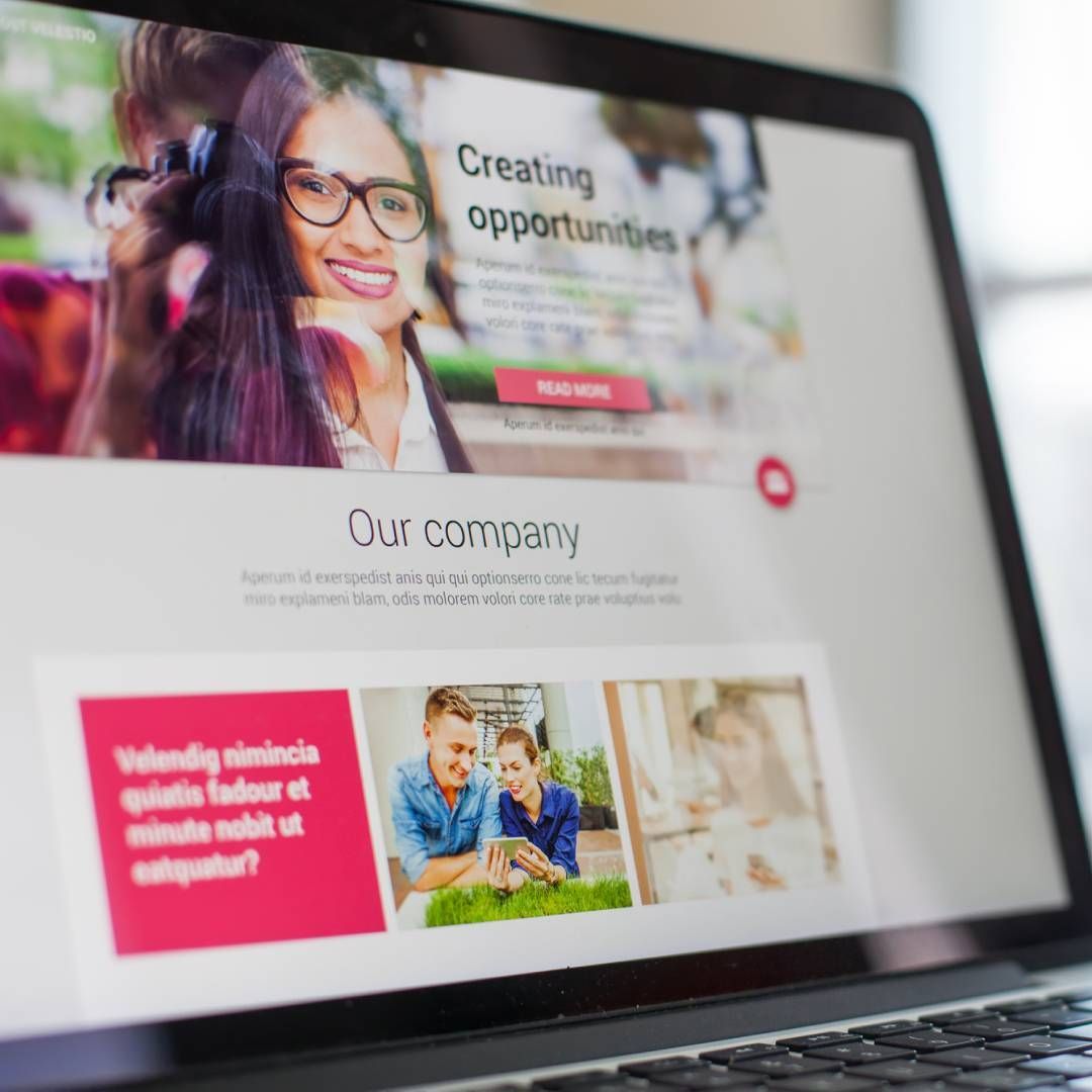 A laptop is open to a page that says creating opportunities