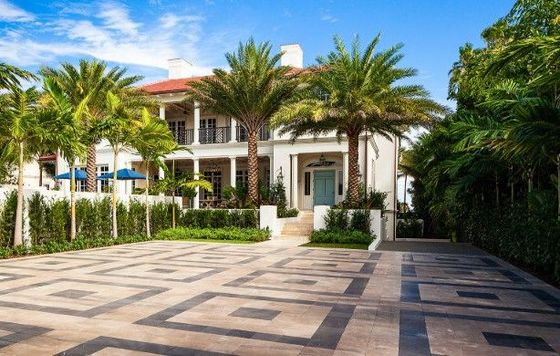 Large driveway with natural stone and paver box pattern in Palm Beach, Florida