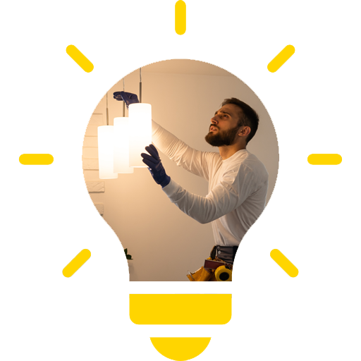 A man is installing a light fixture in a light bulb.