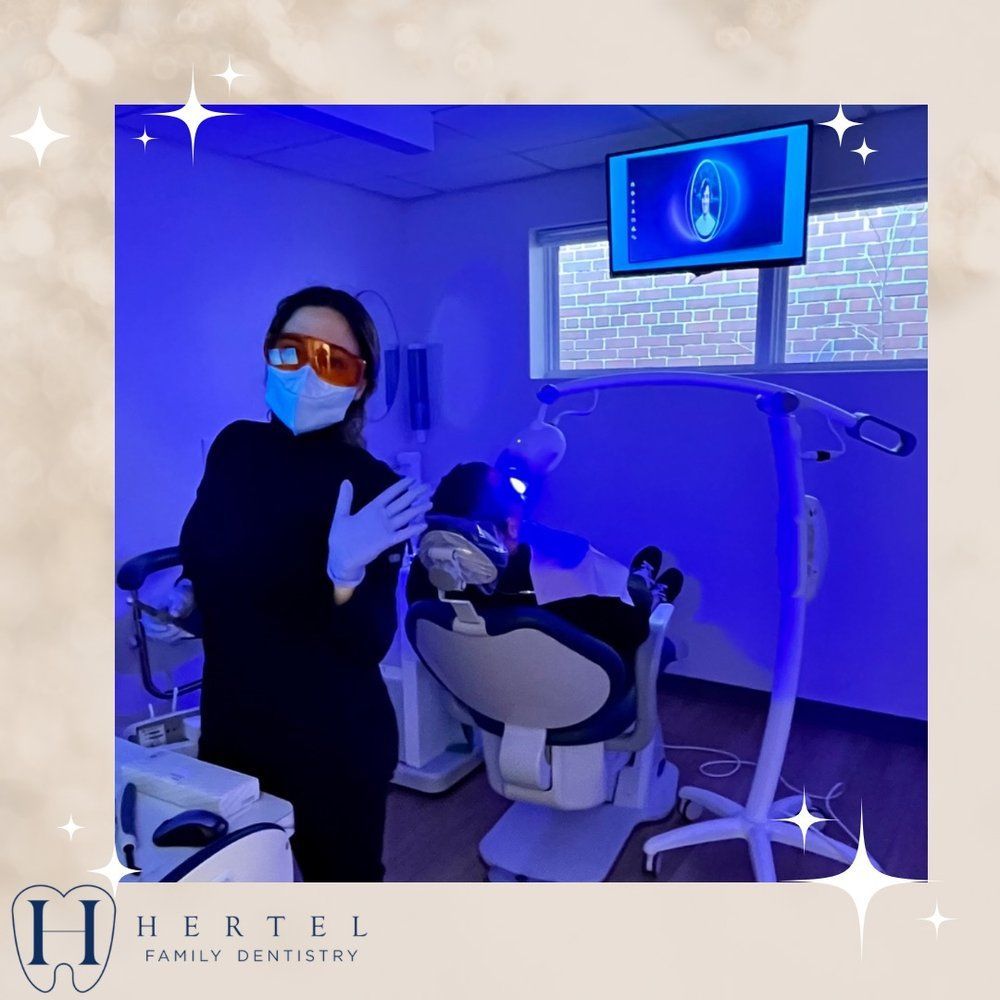 A Dentist in Front of a Dental Chair - Buffalo, NY - Hertel Family Dentistry