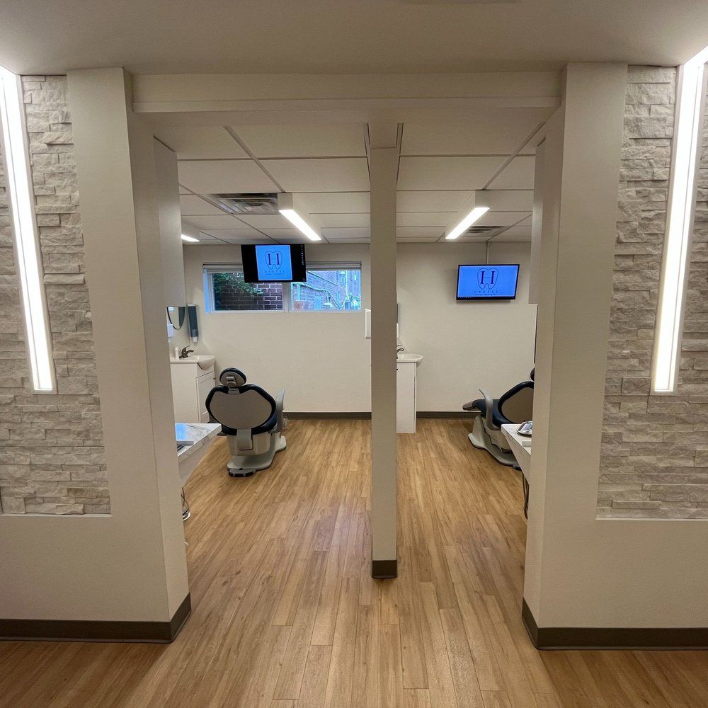 Dental Office With Wooden Floors and a Brick Wall - Buffalo, NY - Hertel Family Dentistry