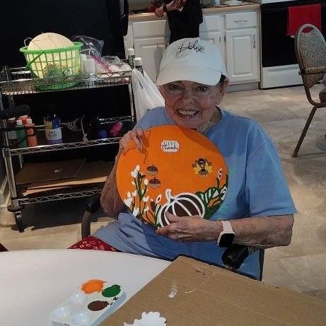 Resident holding thanksgiving plate from the craft activities at the SpiritCare Center