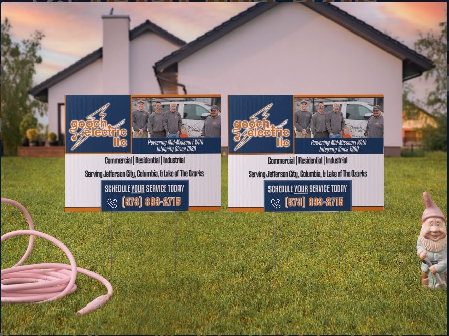 Two identical lawn signs in front of a house advertising 