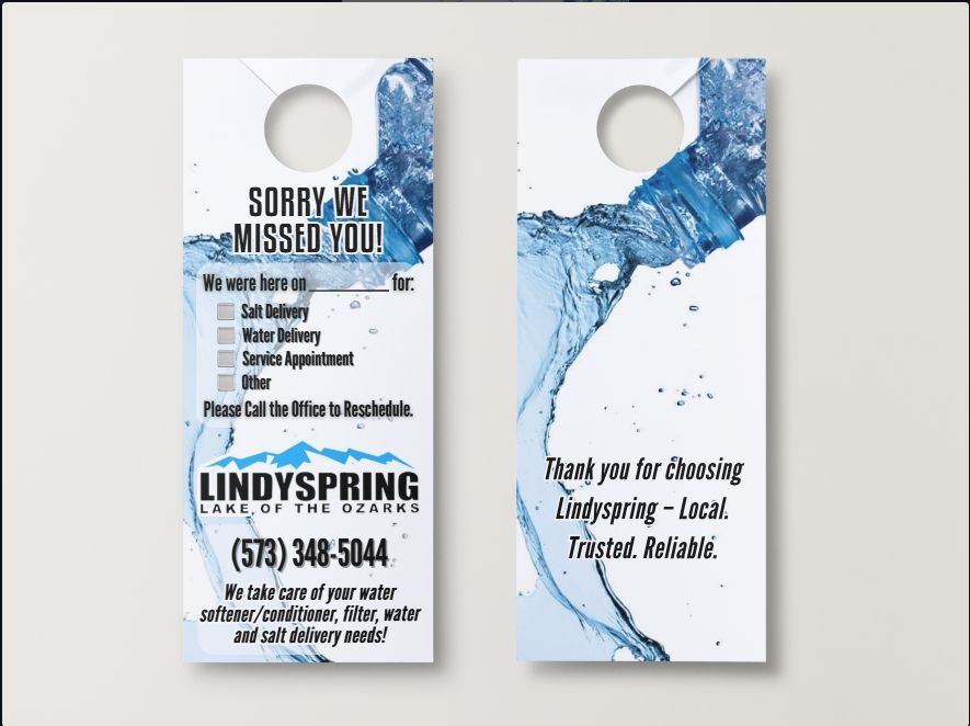 Two Lindyspring door hangers with blue water graphics, contact information, and service check-boxes on a plain background.
