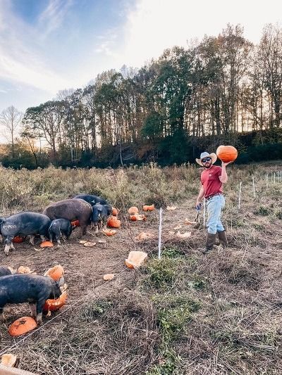family on farm with pumpkins rockhouse farms