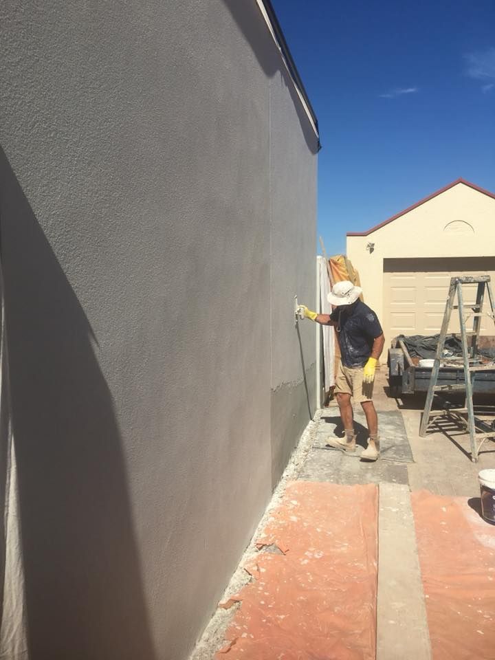 Man Plastering Sidings - Adelaide, SA - Master Plasterers