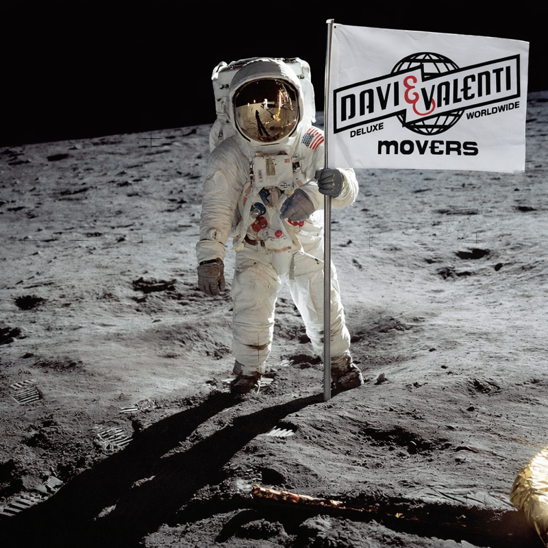 Globe covered in flags surrounded by cardboard boxes, representing international trade.