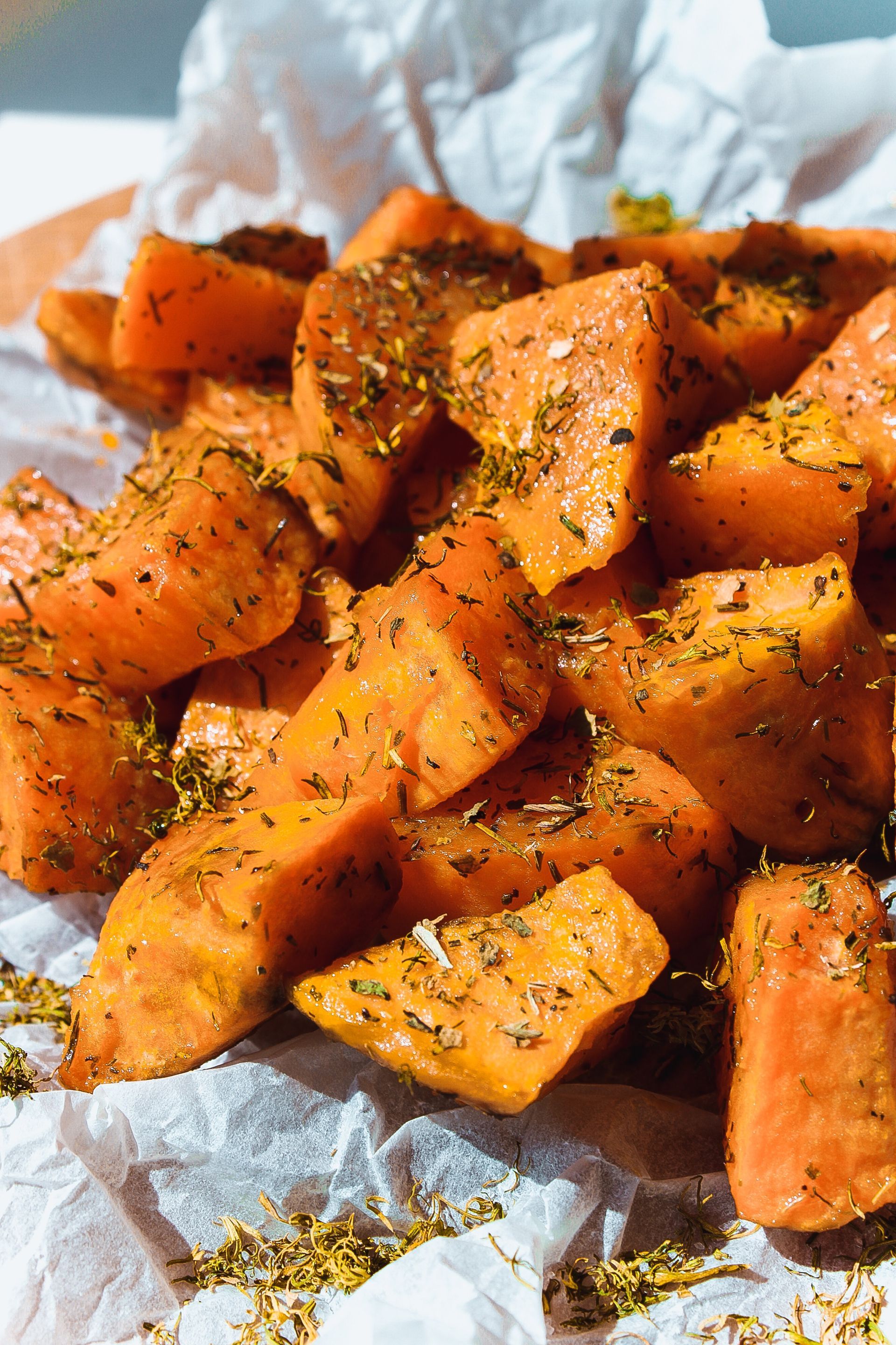 A close-up shot of seasoned sweet potatoes