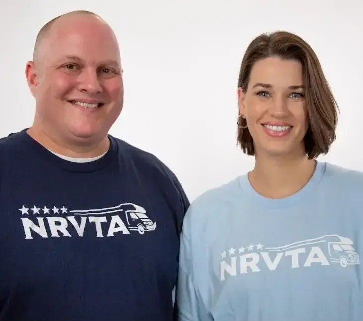 Two people wearing blue shirts with