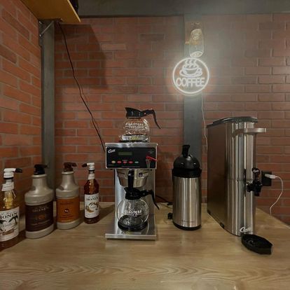 A coffee shop with a sign that says coffee on it
