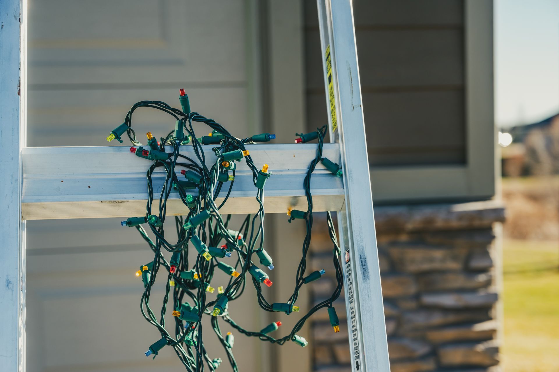 Ladder with tangled christmas lights