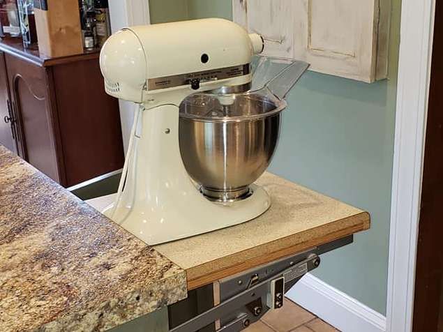 Food Mixer on Top of Wood Counter