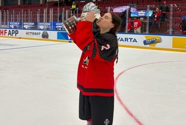 Maynard in Finland, celebrating gold with Team Canada.