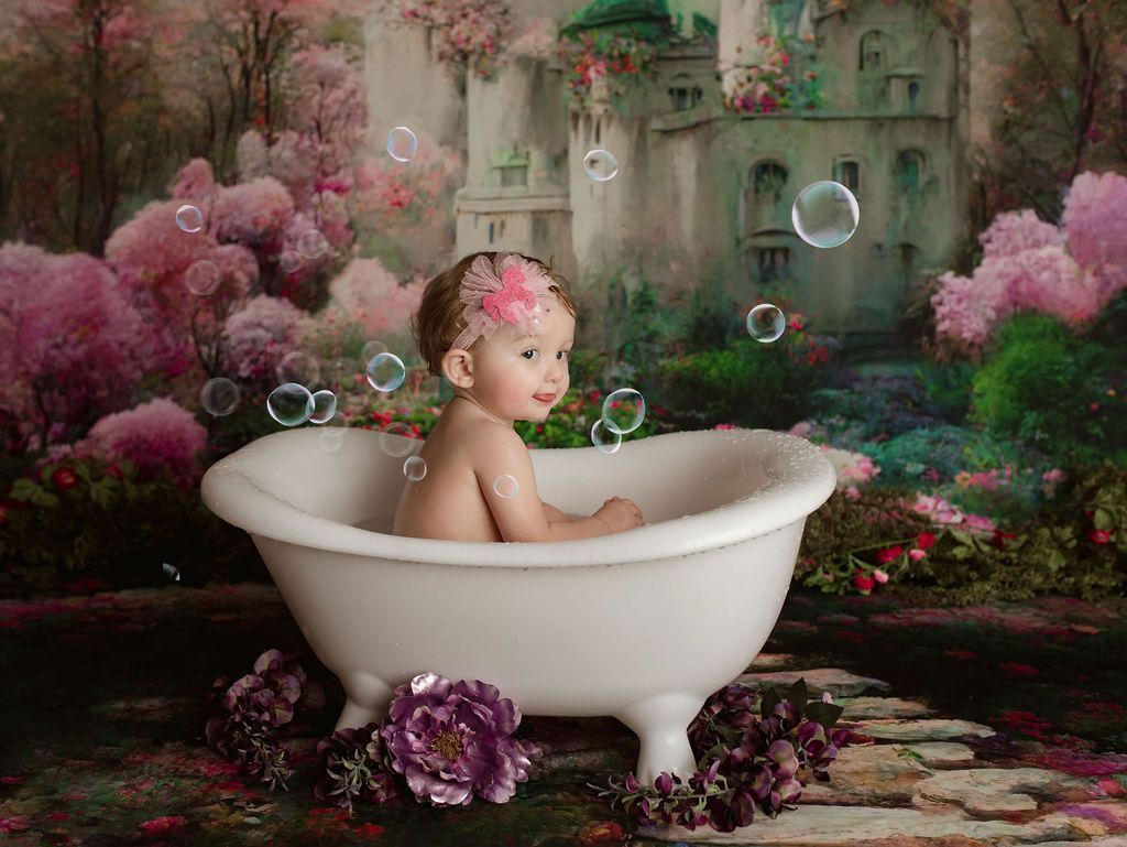 A baby is sitting in a bathtub surrounded by bubbles.