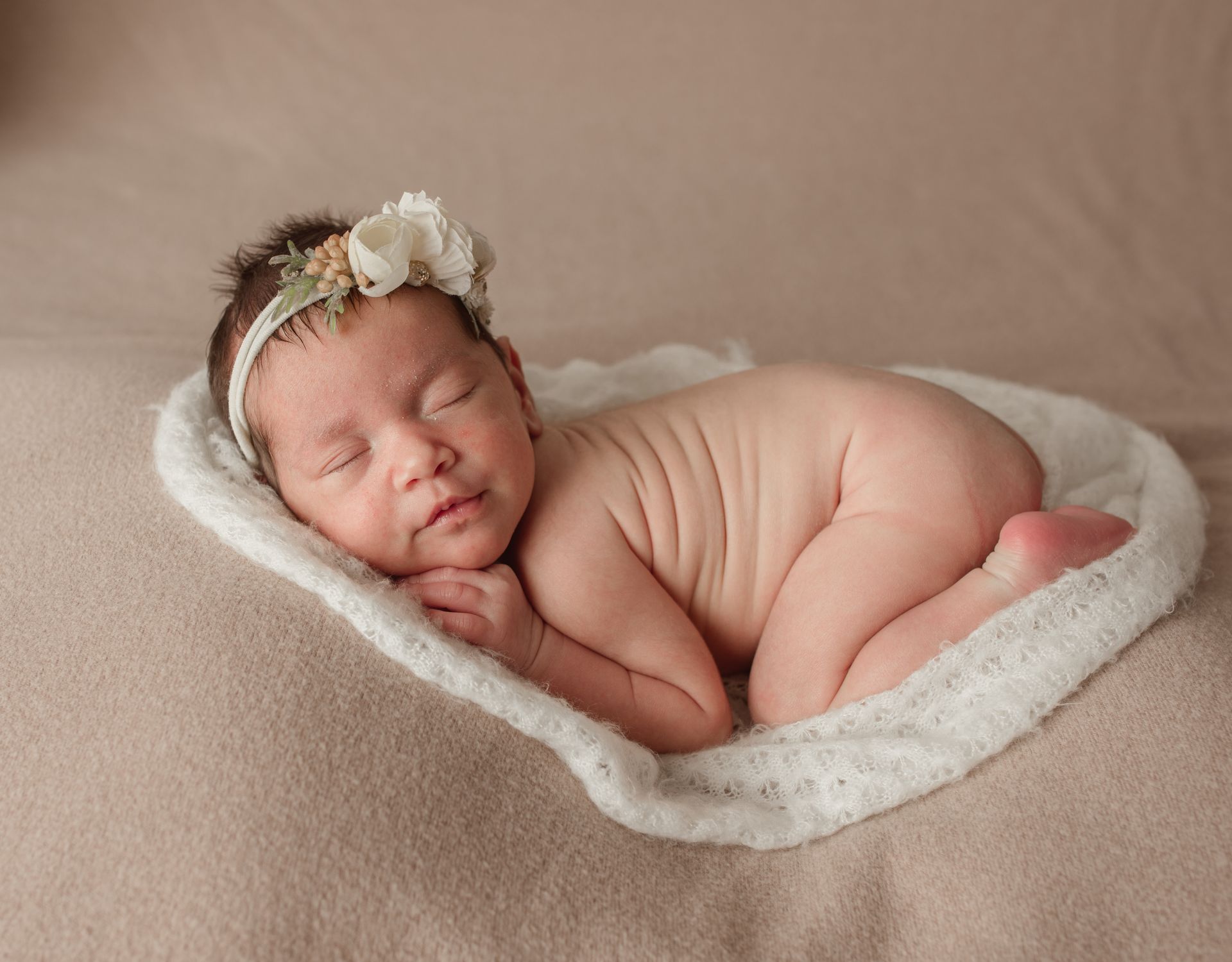 Newborn posed squished, newborn floral portrait ideas.