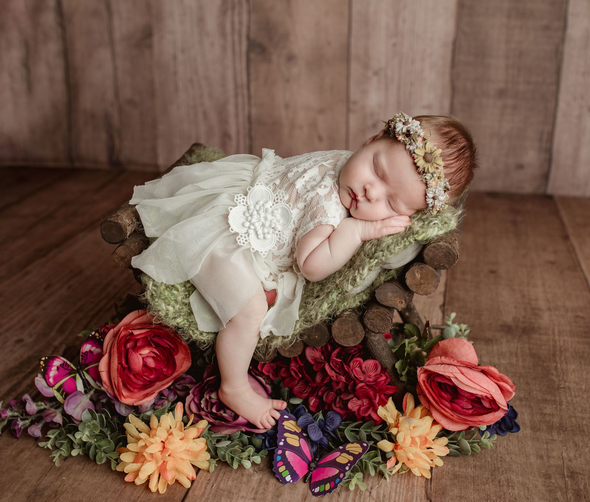 Newborn photo with butterflies. Newborn studio with props.