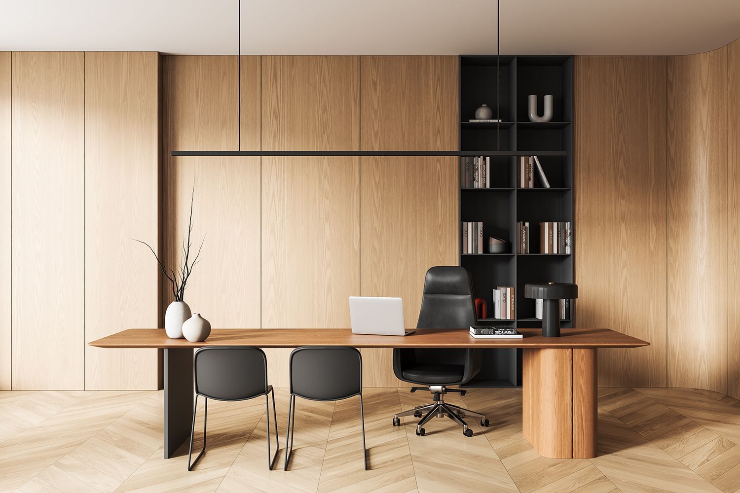 Office with wooden walls, desk, chairs, bookshelf, and laptop.