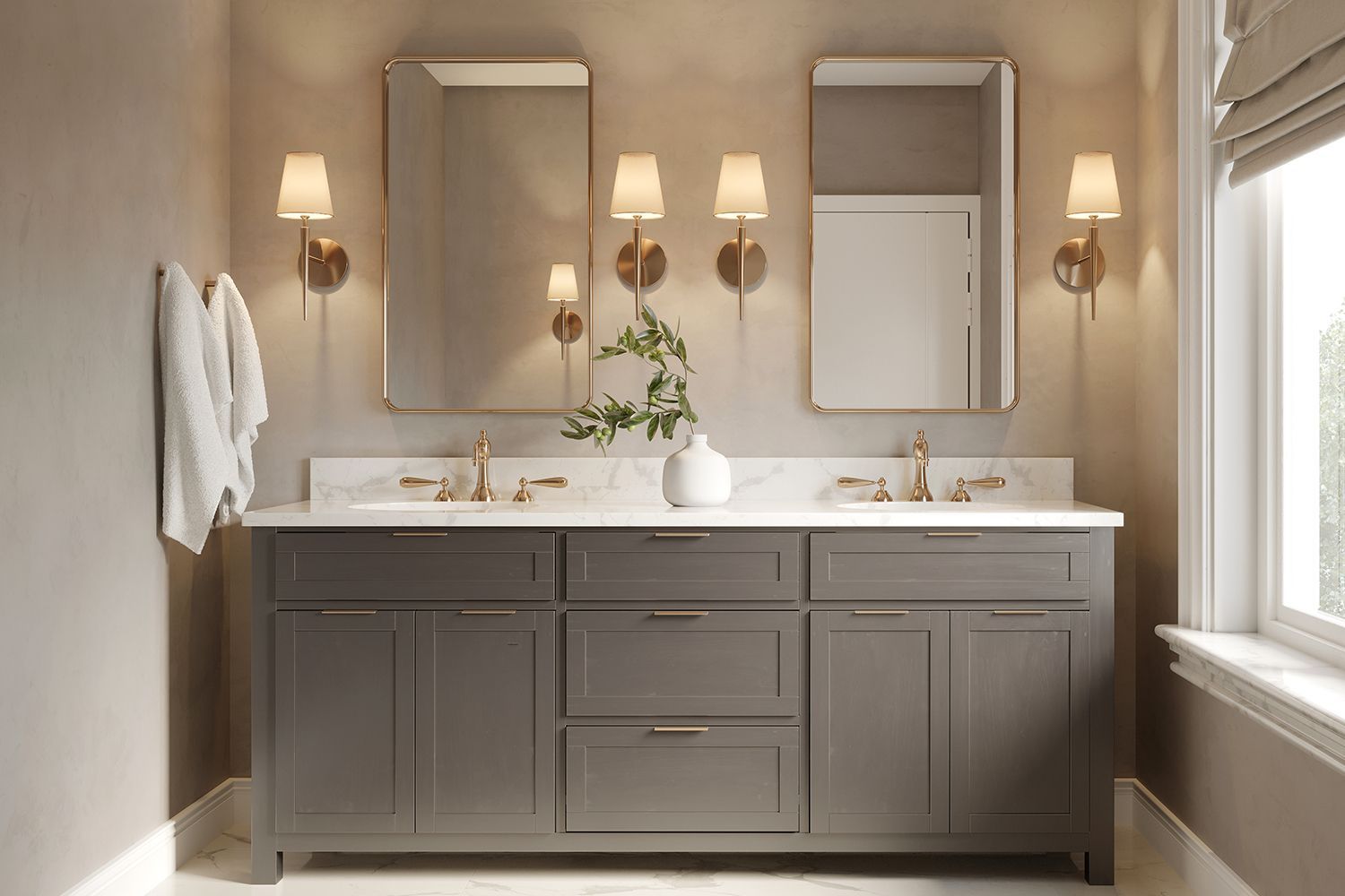 Bathroom with gray vanity, marble countertop, gold fixtures, mirrors, and sconces. Bathroom with gray vanity, marble countertop, gold fixtures, mirrors, and sconces.