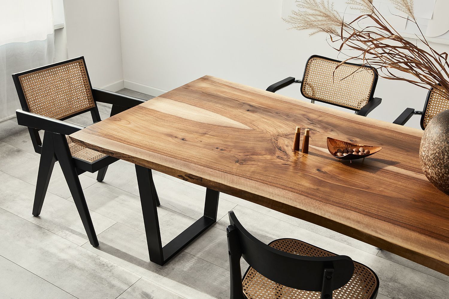 Wooden dining table with four chairs, neutral tones. Wooden dining table with four chairs, neutral tones.