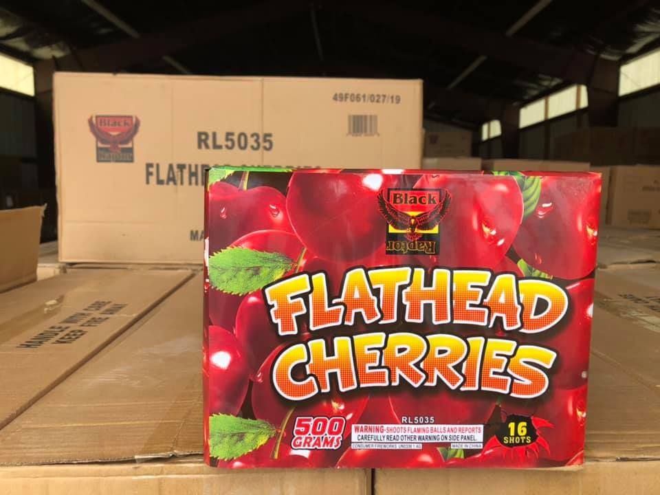 A box of flathead cherries fireworks in a warehouse
