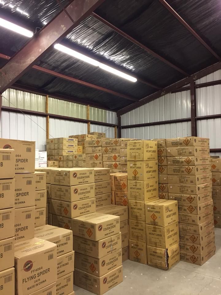 A large warehouse filled with lots of cardboard boxes