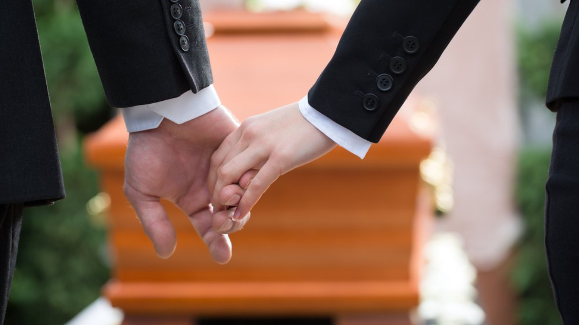 comforting a loved one at a funeral