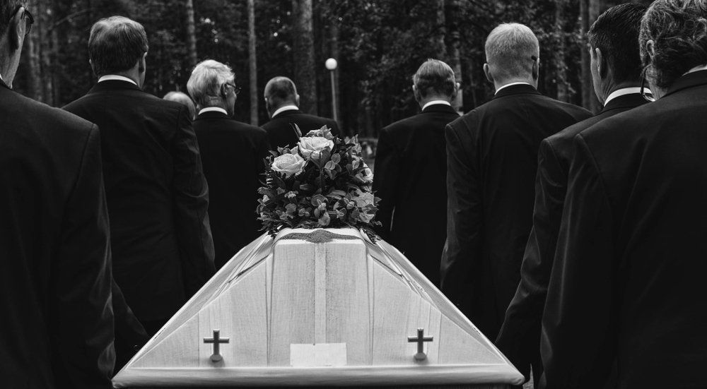 pallbearers carrying a coffin