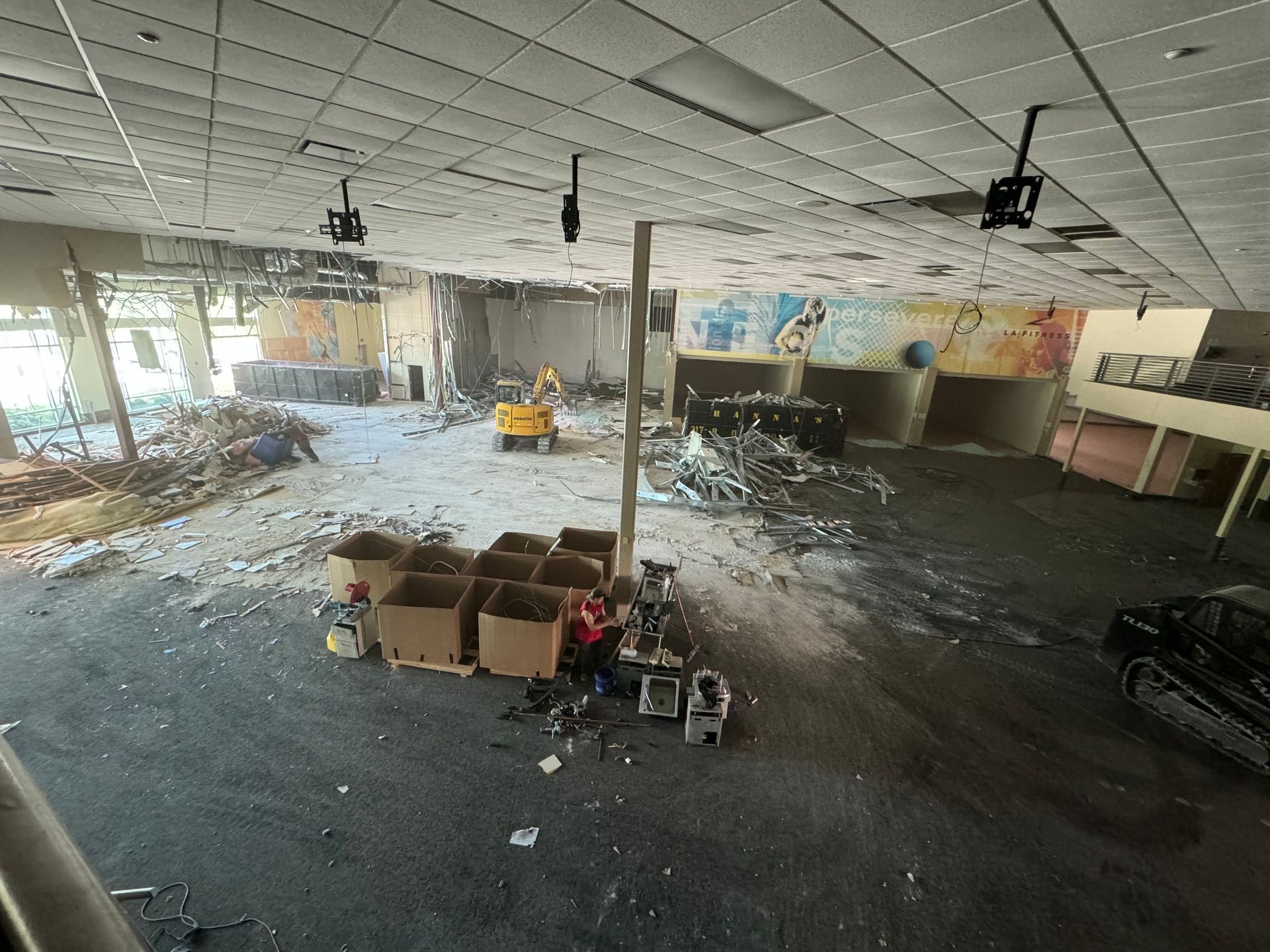 An aerial view of a building being demolished.