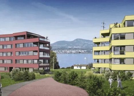 Künstlerische Darstellung eines Gebäudes mit Blick auf einen See.