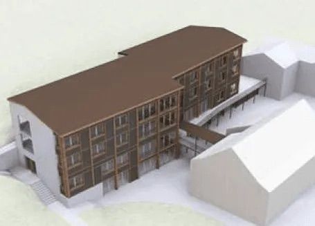 Eine Luftaufnahme eines großen Gebäudes mit einem braunen Dach