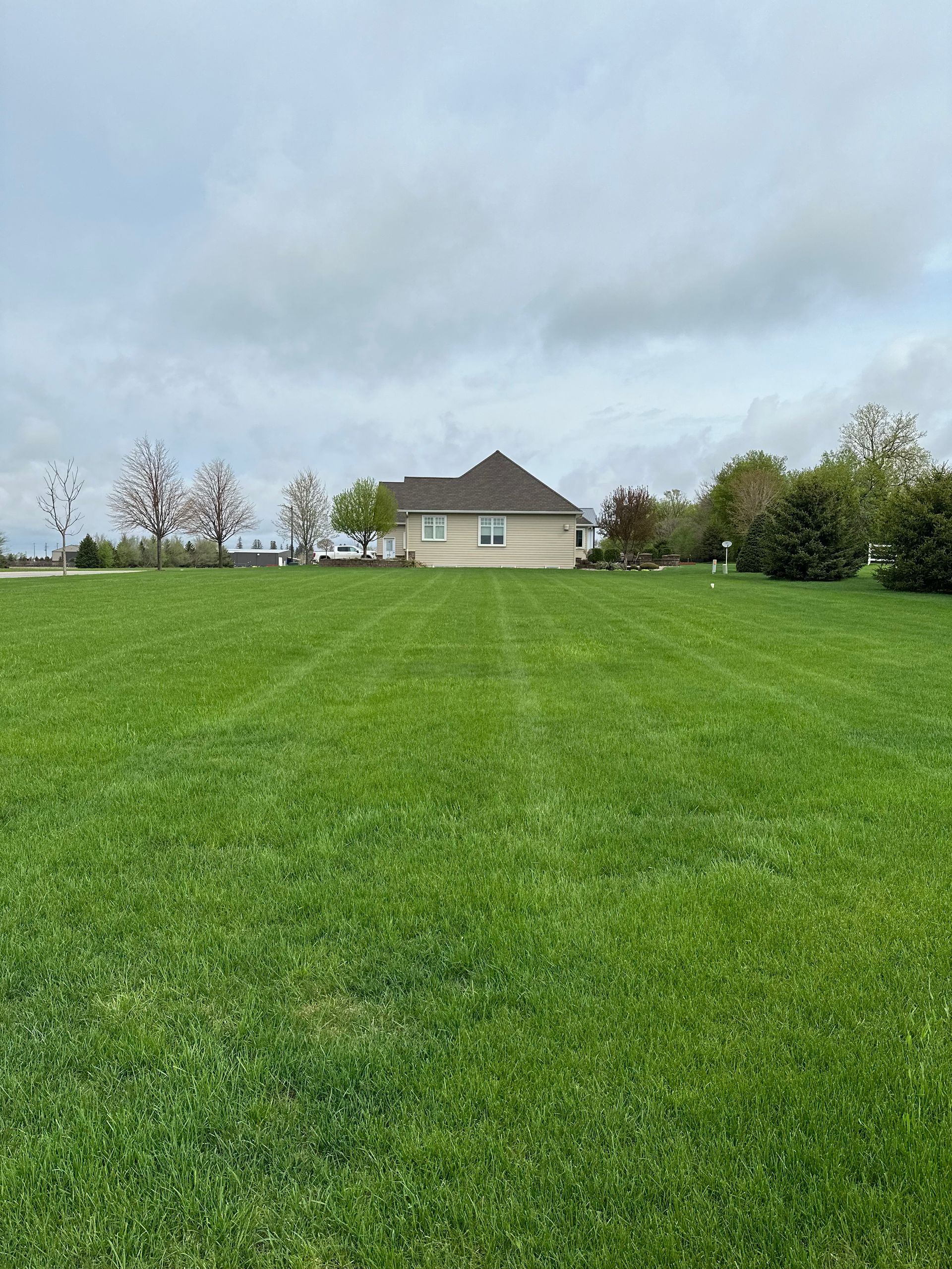 House With Wide Lawn — Hutchinson, MN — Green Earth Lawn Care