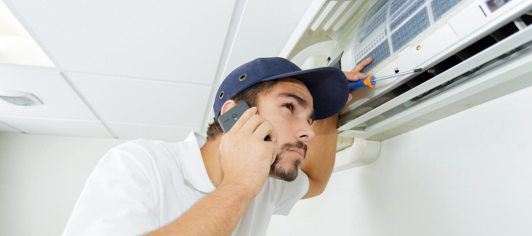 A man checking his air ducts to decide whether he need repairs or replacement