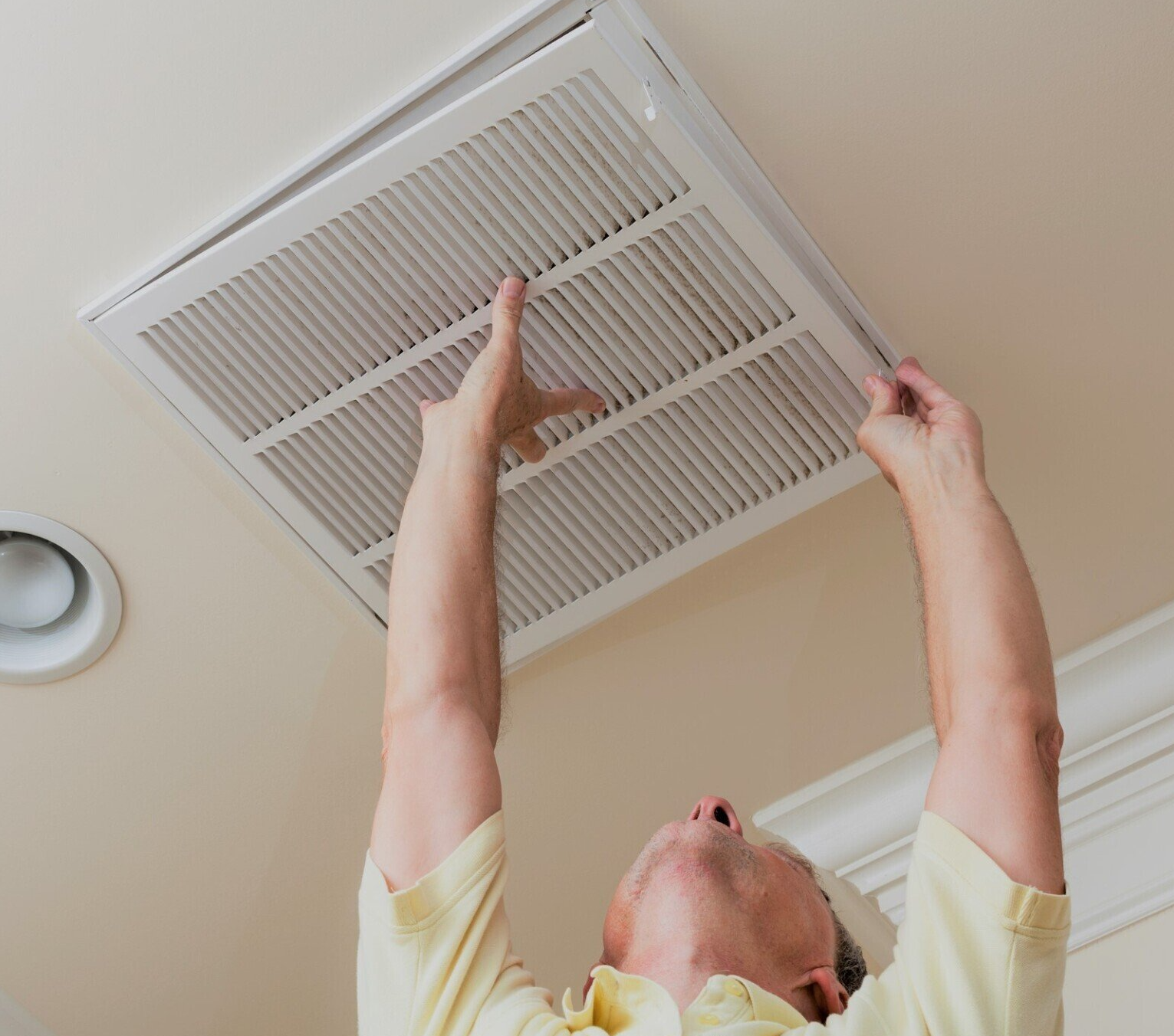 man changing the duct filter