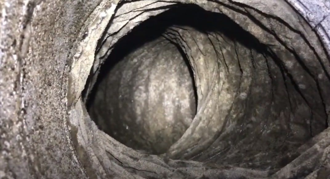 Close-up view of duct during inspection.