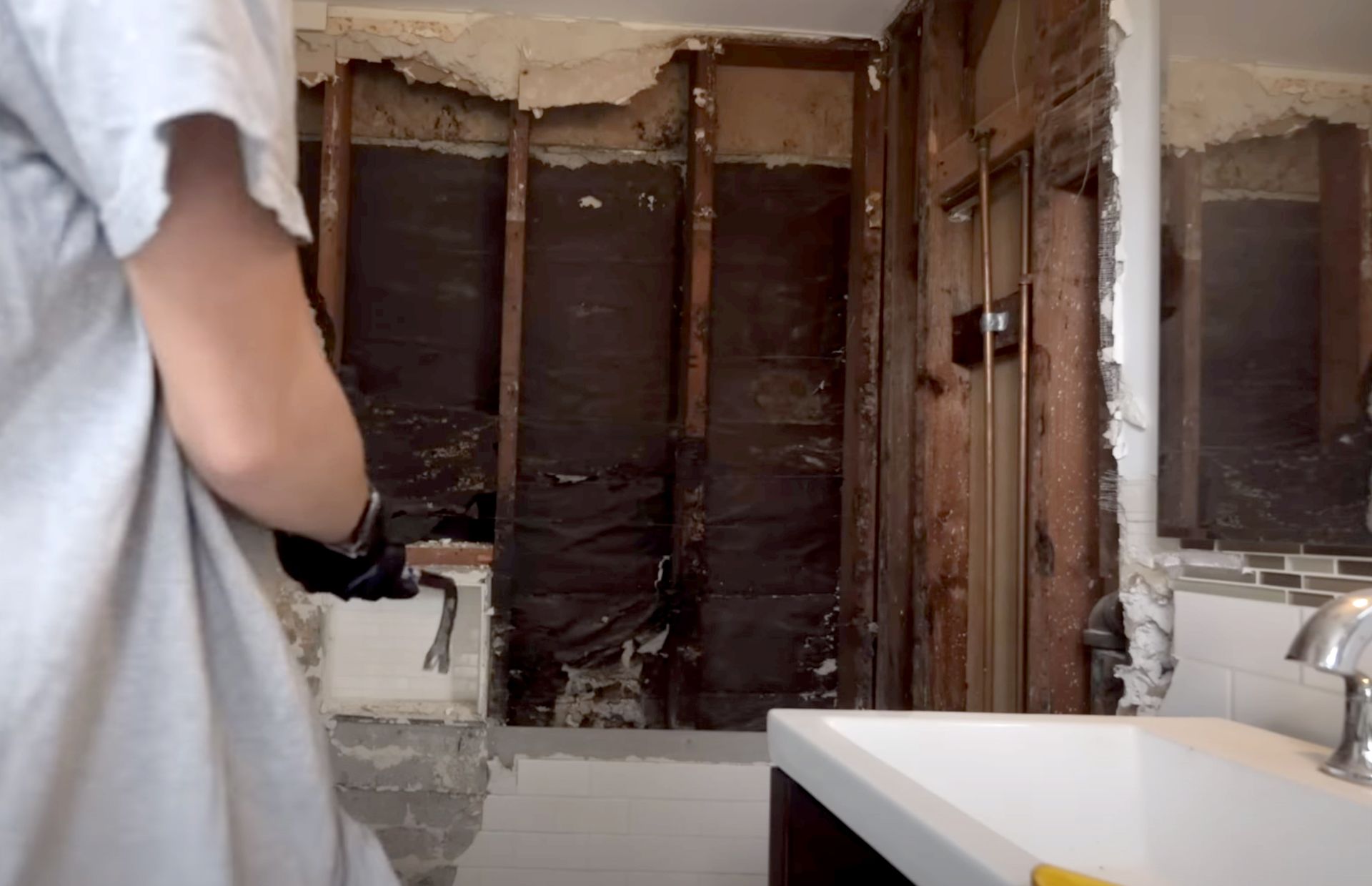 homeowner renovates bathroom of house