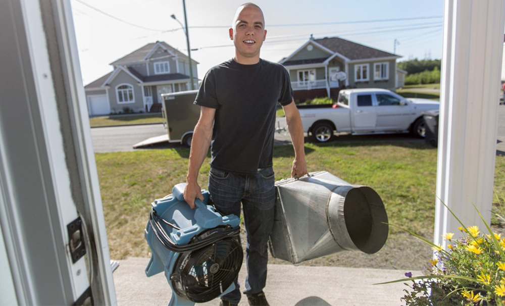 duct cleaning technician arriving at job