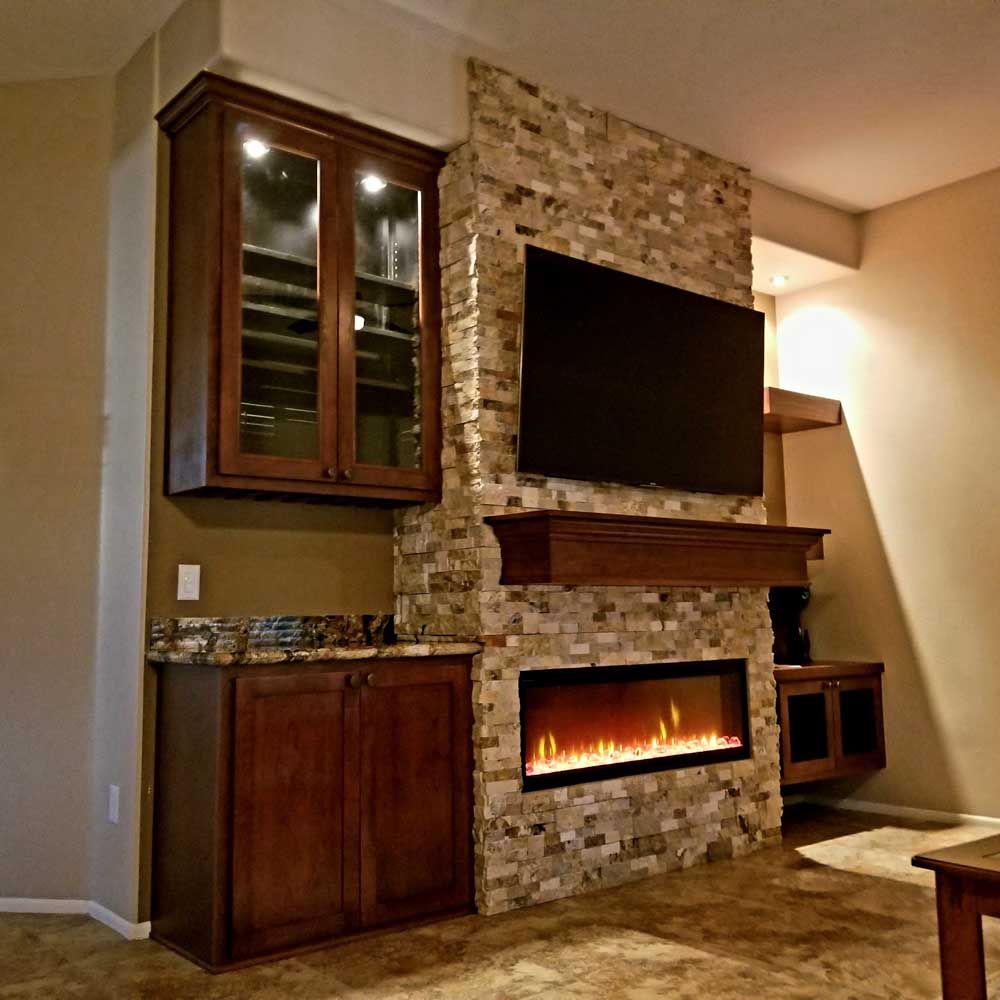 A living room with a fireplace and a flat screen tv.