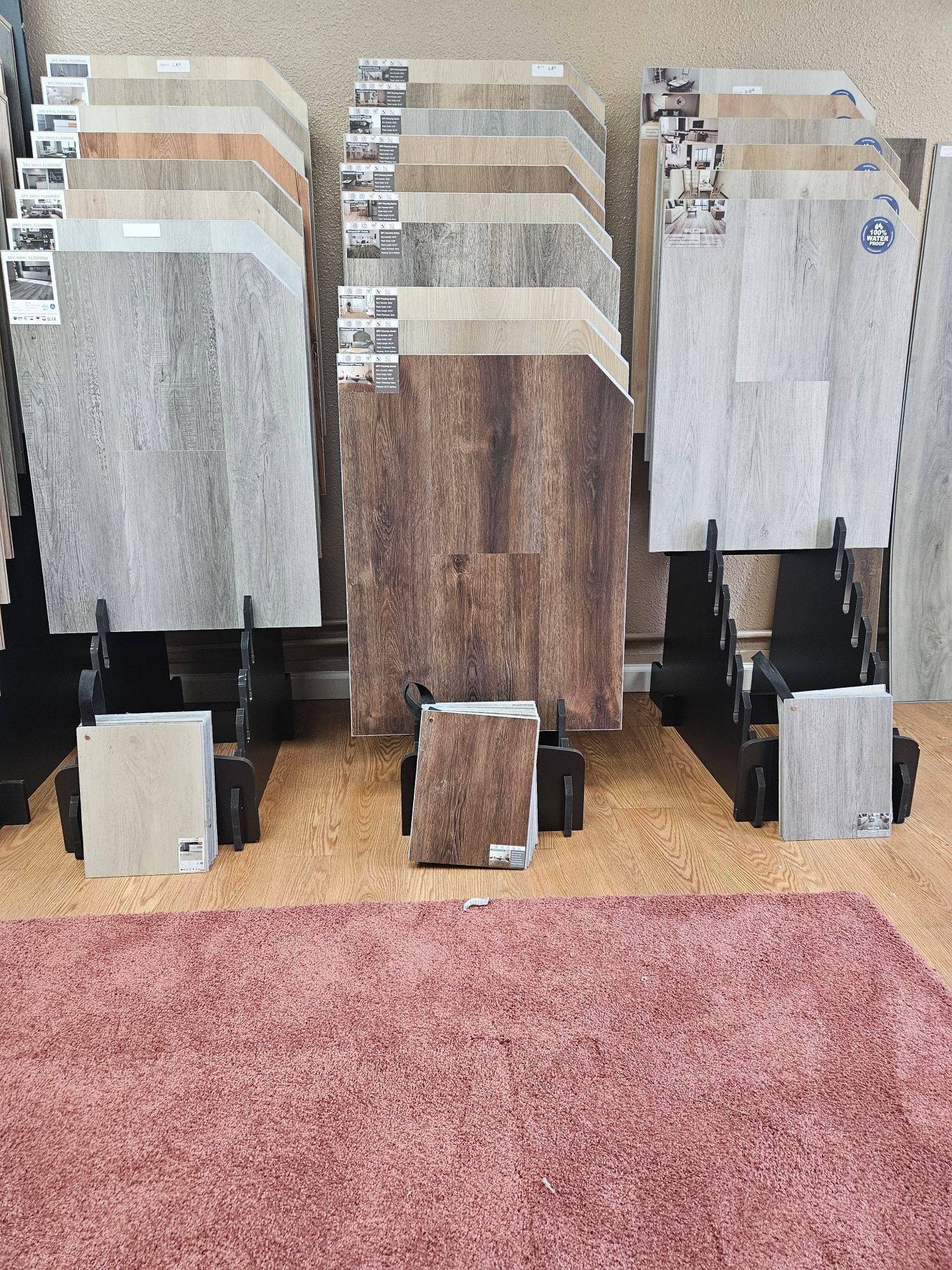 There are many different types of tiles on display in a store.